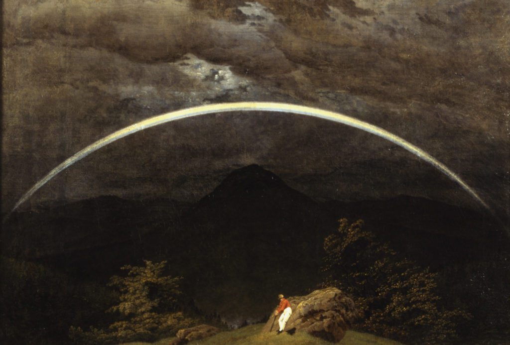 painting of a rainbow above man in a dark sky