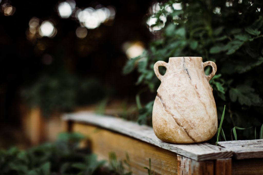 alabaster jug in a garden