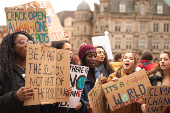 group of young women protesting for climate change